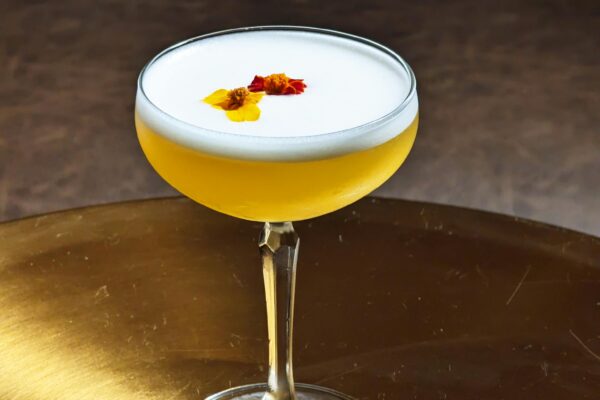 A Yellow Cocktail with a Foam